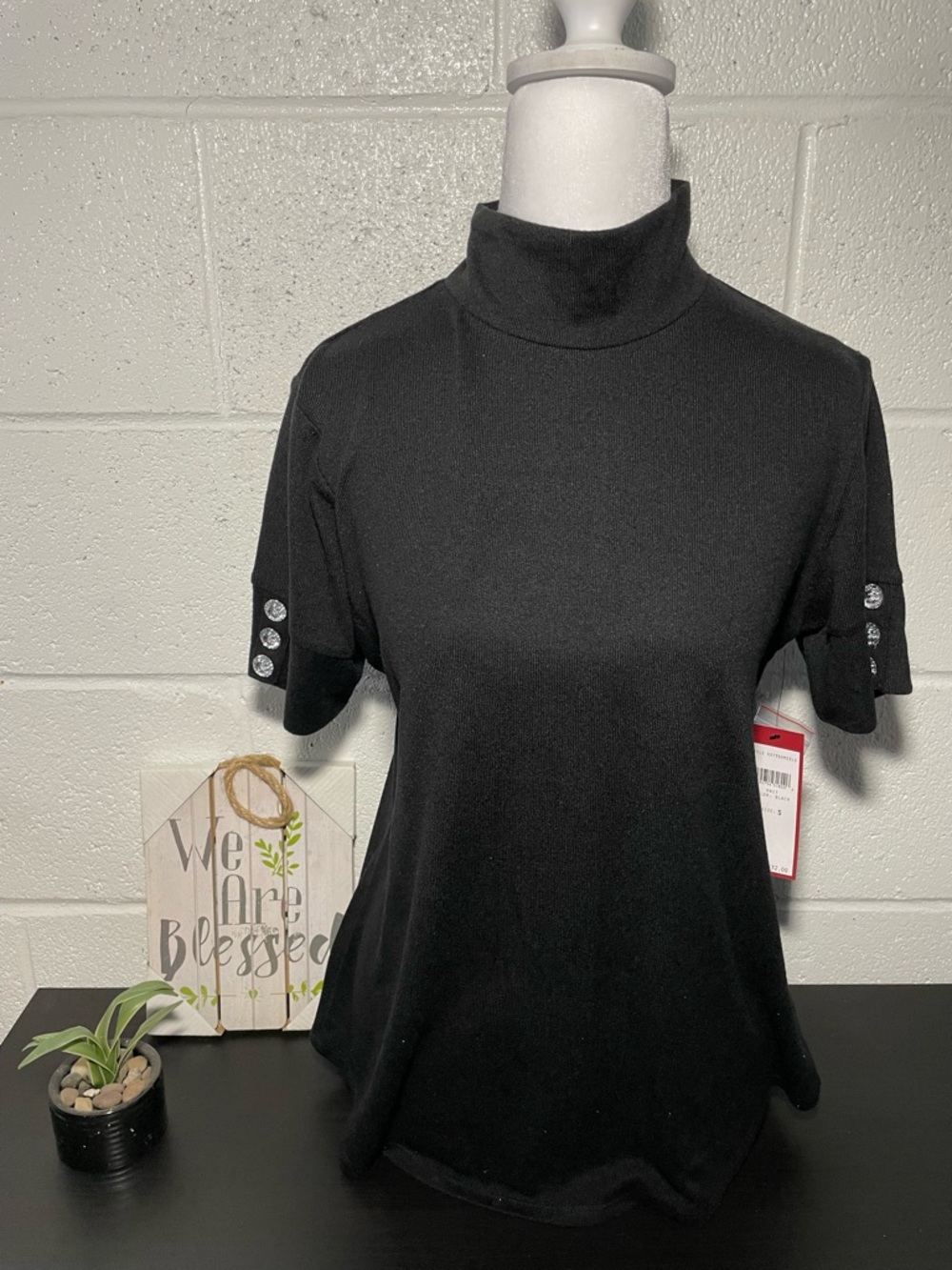 Women's Black Short Sleeve Mock Neck Top with Button Cuff Detail